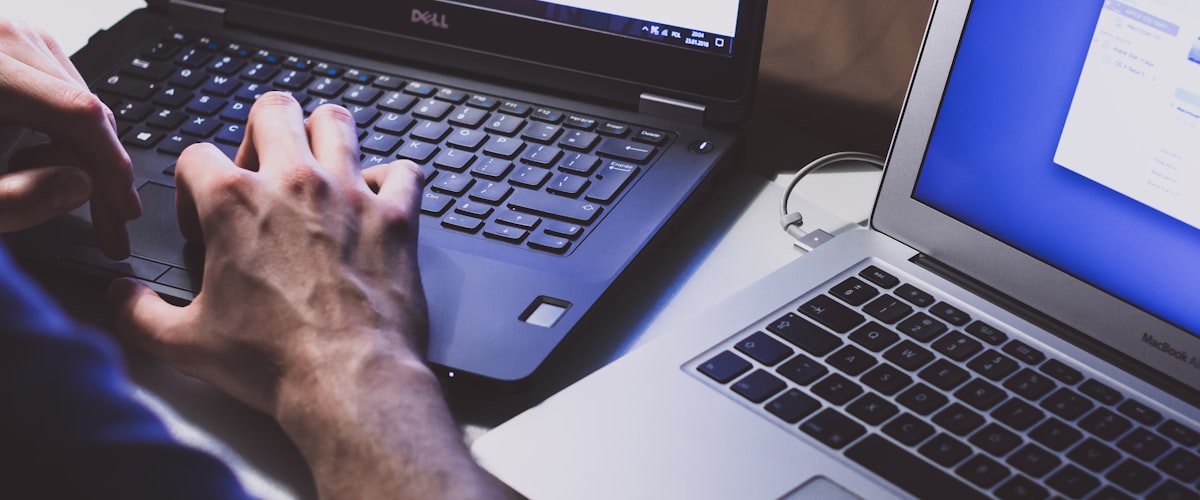 Woman working with laptop and devices